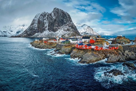 Hamnoy fishing village with red rorbu houses in Norwegian fjord in winter. Lofoten Islands, Norway,