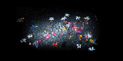 Illustration of scattered puzzle pieces sprawled across as a wallpaper background, AI generated