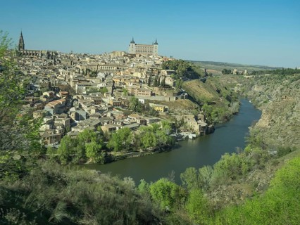 Historic city on the river with impressive architecture and striking church towers, situated on a