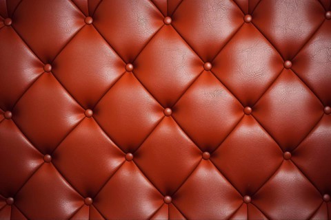 Red leather upholstery. KI generiert, generiert, AI generated