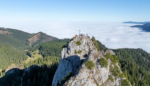 Aerial view, rocky summit of the Ettaler Manndl, view over mountain landscape and sea of clouds,