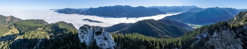 Aerial view, rocky summit of the Ettaler Manndl, view over mountain landscape and sea of clouds,