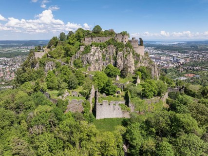 Aerial view of the Hohentwiel volcanic cone with Germany's largest fortress ruins, behind it the