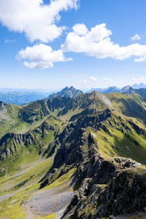 Mountain panorama at the summit of the Hochspitz or Monte Vacomun, view of the mountain ridge of