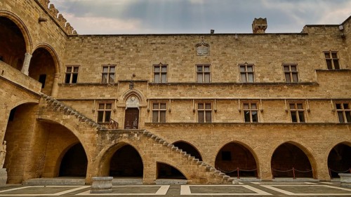 Courtyard of a castle with archways, columns and a stone staircase, sky replaced, courtyard, Grand