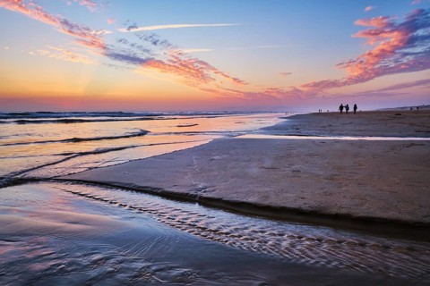 Atlantic ocean after sunset with surging waves at Fonte da Telha beach, Costa da Caparica,