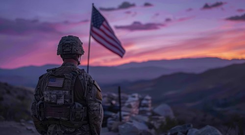 American patriot soldier stand in front of the flag. Concept of fighting for freedom and democracy,