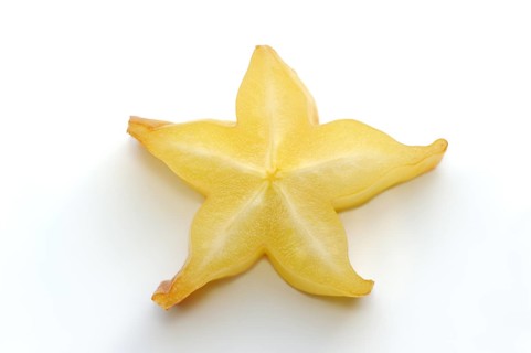 Star fruit or carambola (Averrhoa carambola), sliced fruit on a white background