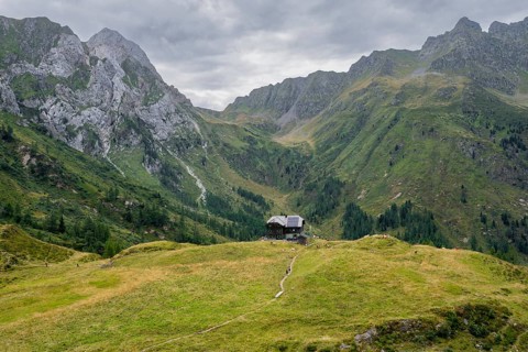Alpine club hut, Hochweisssteinhaus mountain hut, mountain landscape with green mountain meadows