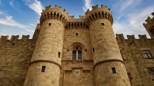 Detailed view of two tin towers of the castle in front of a cloudy sky, main portal, Grand Master's
