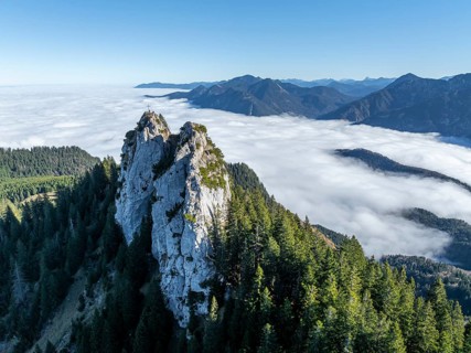 Aerial view, rocky summit of the Ettaler Manndl, view over mountain landscape and sea of clouds,