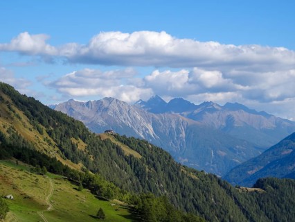 View over the Bodenalm in Virgental and across the Matreier Tauerntal to the peaks of the Hohe