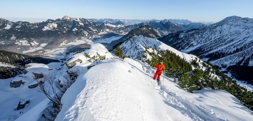 Mountaineer on the summit of the Aiplspitz in the snow, snow-covered mountain landscape with
