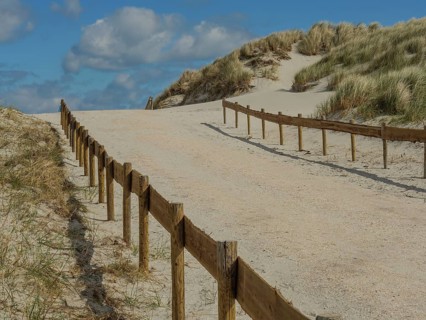 Sand dunes by the sea with blue sky and clouds, nes, ameland, netherlands