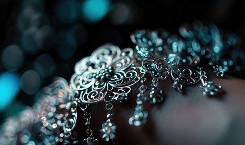 A delicate silver charm bracelet adorned with intricate filigree details AI generated
