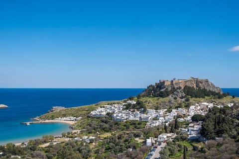 View of the Acropolis and the white houses of Lindos, Rhodes, Dodecanese archipelago, Greek