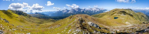 Panorama, hiking trail between green mountain meadows on a mountain ridge, mountain panorama, view