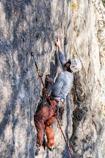 Sport climbing with rope, climber on a rock face, Frauenwasserl climbing garden, Ammergau Alps,