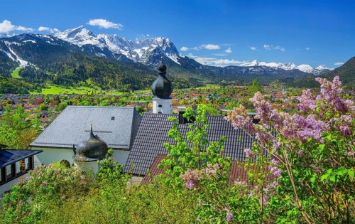 Pilgrimage church St. Anton in spring above the village in front of the Zugspitze group 2962m in