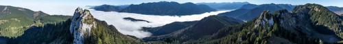 Aerial view, rocky summit of the Ettaler Manndl, view over mountain landscape and sea of clouds,