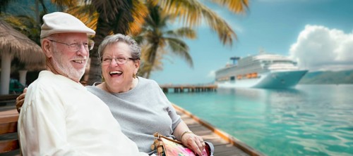 Senior adult couple enjoying the view from the dock with passenger cruise ship in the background