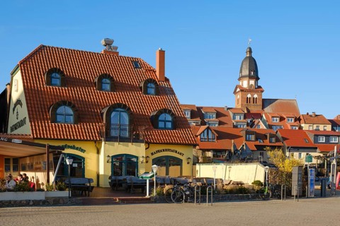 Town view with harbour restaurant and St. Marien church, Waren, Mueritz, Mecklenburg Lake District,