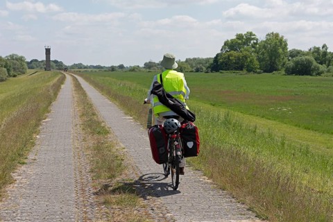Cyclist, former watchtower, Elbe cycle path near Boizenburg, Mecklenburg-Western Pomerania,