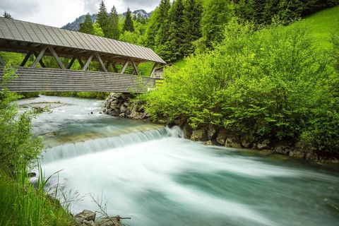 Covered wooden bridge over the Stillach, Stillachtal near Oberstdorf, Allgaeu Alps, Allgaeu,