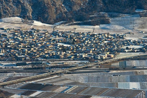 The municipality of Riddes in the Rhone Valley surrounded by vineyards in winter, Riddes, Valais,