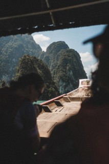 Interior view of a boat with a view of a mountain backdrop. Khao Sok National Park, Thailand, Asia