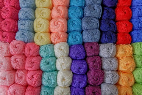 Close-up of a group of balls of colored wool with a pattern