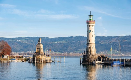 Harbour entrance of Lindau harbour, pier with New Lindau Lighthouse and Bavarian Lion, in the