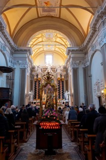 People Praying Inside the Church of San Nazzaro (Croglio) in Castelrotto, Ticino, Switzerland,