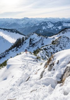 Hikers in winter descending the Aiplspitz, Mangfall mountains, Bavarian Prealps, Bavaria, Tyrol,