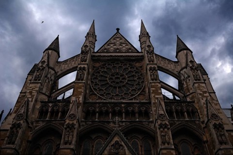 Gothic side portal (detail) of Westminster Abbey in rainy weather, Dean's Yard, London, England,