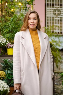 Outdoor portrait of pretty woman in coat