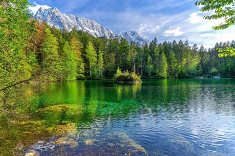 Lake Badersee in spring with Zugspitze group 2962m in the Wetterstein mountains, Zugspitz village