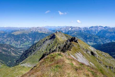 Grassy mountain ridge and view of the Lesach Valley, mountain panorama, Carnic High Trail, Carnic
