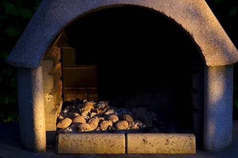 Outdoor photo, ash, charcoal, briquettes, coal, charcoal residue, not completely burnt, lying in a