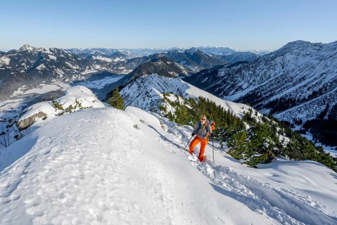 Hiker in winter climbing the Aiplspitz, Mangfall mountains, Bavarian Prealps, Bavaria, Tyrol,
