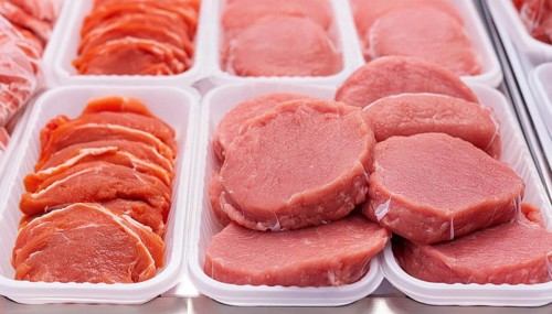 Meat, raw pork, schnitzel, in a display of a butcher's shop, AI generated, AI generated