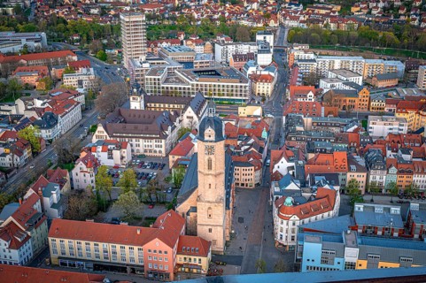 The Protestant town church of St Michael in Jena from above with the new university campus complex