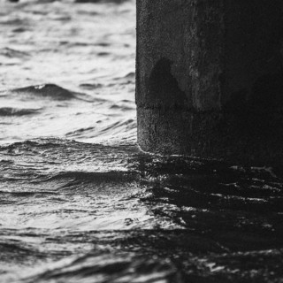 Artistic detail shot of the water. Taken in black and white at a lake in Tauranga, New Zealand,