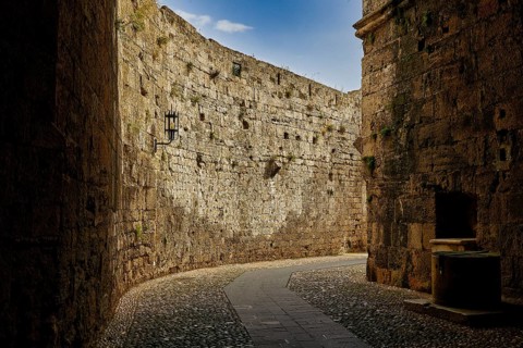 Paved path along an old fortress wall with rich stone texture, Grand Master's Palace, Knights'