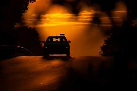 A passenger car drives along a country road in Frankfurt am Main, Frankfurt am Main, Hesse,