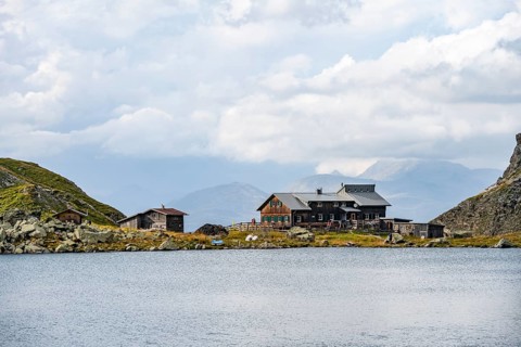 Obstanserseehuette mountain hut on the Obstansersee mountain lake, Carnic main ridge, Carnic High