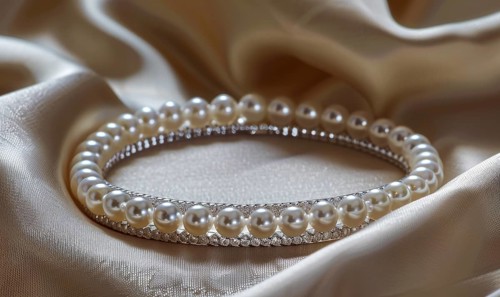 A pearl bangle bracelet with intricate detailing laid out on a smooth satin material background AI
