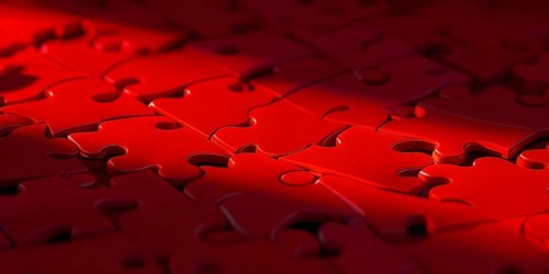 Illustration of scattered red puzzle pieces sprawled across as a wallpaper background, AI generated