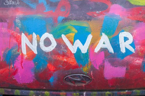 Lettering No War, kein Krieg, colourfully painted vintage car, colour surface, Germany, Europe