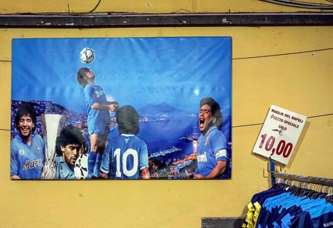 Diego Maradonna poster at a boutique. Maradonna brought success to SSC Napoli in the 1980s, Naples,